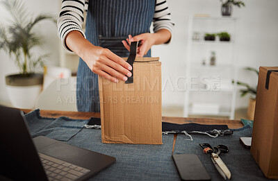 Buy stock photo Packing parcel, package and shop order with duct tape while packaging, boxing and wrapping product. Small business tailor hands with laptop and clothing gift for courier shipping, selling or delivery