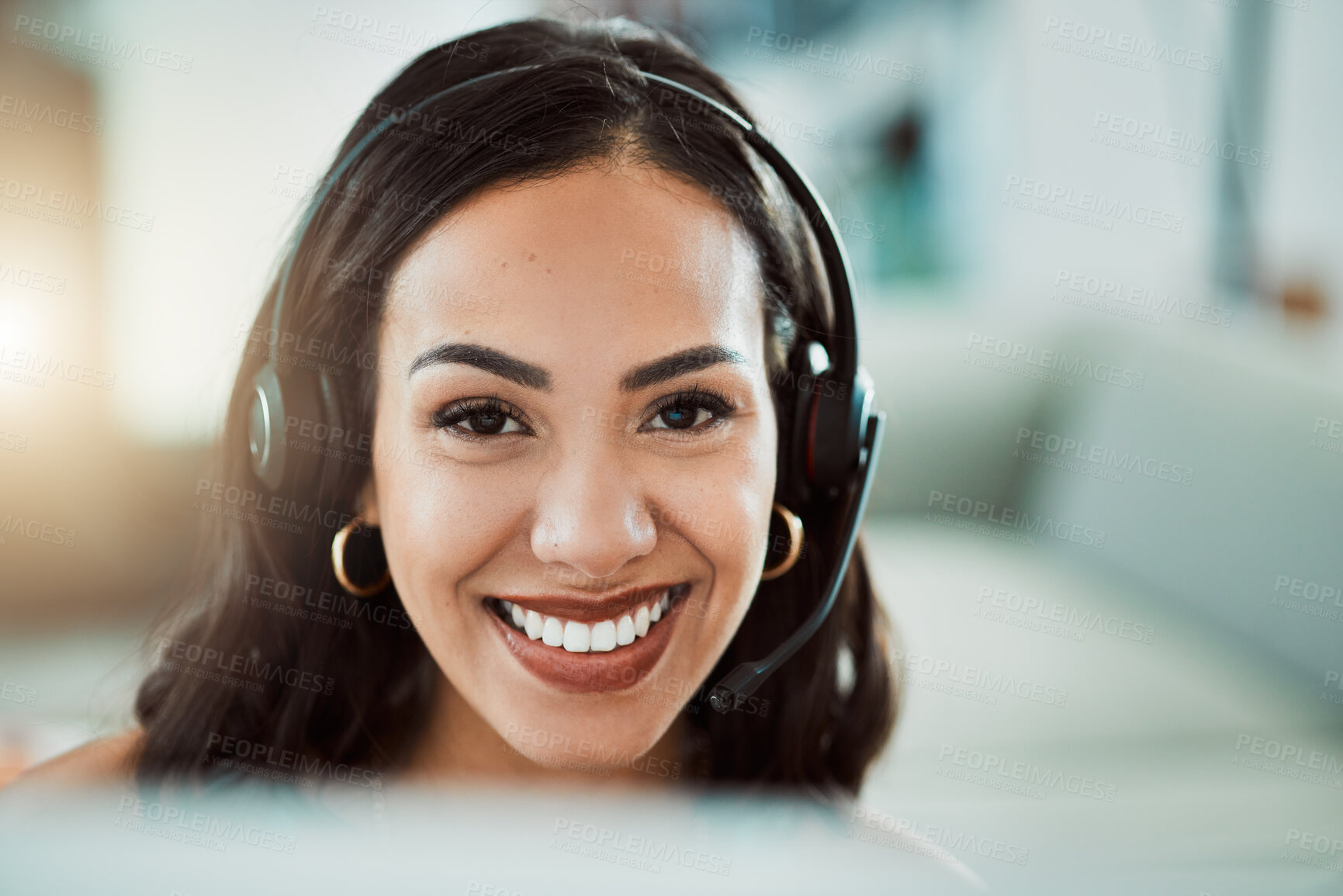 Buy stock photo Call center, customer service and help desk agent looking friendly, happy and smiling while wearing a headset and working on a computer. Portrait of Cheerful sales employee, remote or virtual worker