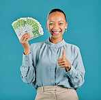 Thumbs up of a woman happy with financial success holding money and cash to budget. Portrait of a young female proud about successful banking finance, investment profit and salary savings growth