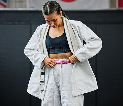Buy stock photo Karate woman ready for fitness workout at gym, learning at a sport club and doing training exercise at a wellness school or studio. Female dojo student preparing for fighting competition at center