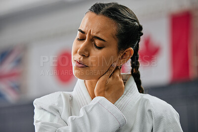 Buy stock photo Woman karate student with bad neck pain at fitness training studio, person holding head from sport injury at health gym and muscle cramp from learning self defense at school. Painful joint accident