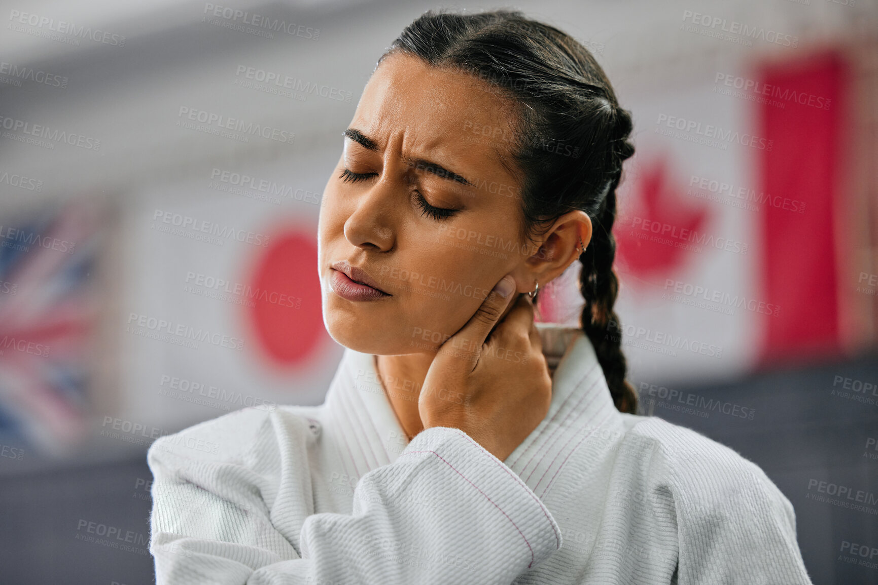 Buy stock photo Woman karate student with bad neck pain at fitness training studio, person holding head from sport injury at health gym and muscle cramp from learning self defense at school. Painful joint accident