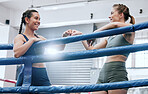Happy, success and support with fist bump from friends after boxing workout, competition or fitness training at a gym. Smiling, carefree and excited women giving motivation and unity after exercise