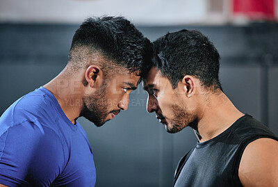 Buy stock photo Healthy, serious and fit male athletes staring, facing and looking ready before a fight. Strong young men in an active challenge, a battle of power against strength and a motivation for winning.