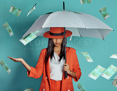 Buy stock photo Money, fashion and rich lady being showered by cash while holding umbrella for insurance, protection and cover showing her wealth after payout. Winning luxury woman with dollar bills in the air