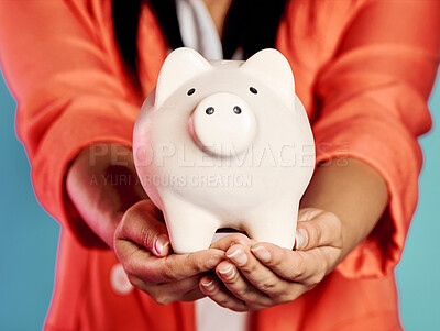 Buy stock photo Closeup of hands holding a piggy bank with her savings and financial investments. Stylish, trendy and elegant female with future planning, looking after her wealth growth developments. 