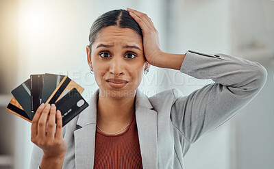 Buy stock photo Stressed, worried businesswoman in debt from shopping at work. Female in corporate finance, money issues headache, holds credit and debit cards. Frustration, economic inflation and expenses.