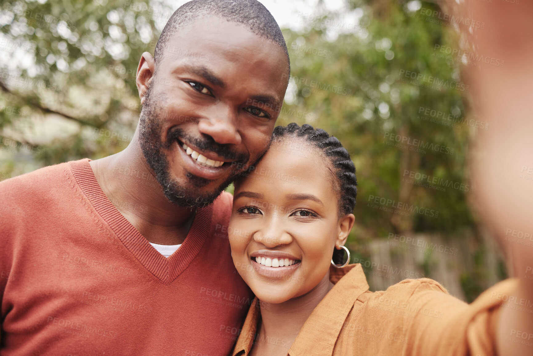 Buy stock photo Happy and smiling couple taking a selfie looking sweet, cute and in love portrait. Young boyfriend and girlfriend capturing their relationship, spending quality time and bonding or relaxing together