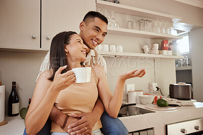 Buy stock photo Happy, loving and romantic couple bonding, standing and hugging at home in the kitchen. Husband and wife talking, affection and enjoying feeling carefree while having a cup of coffee in the morning