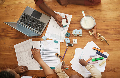 Buy stock photo Writing and tax papers of parents with home school kid busy with remote work at a family home. Above view of a child at a table while mom and father work on finance, audit and business documents 