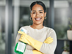 Cleaning, hygiene and chores with a spray bottle while wearing gloves and smiling at home. Portrait of a happy woman, cleaner or housewife ready to do housework to keep things neat, tidy and fresh