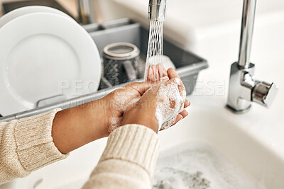 Buy stock photo Hygiene, cleaning and washing hands with soap and water in the kitchen sink at home. Closeup of a female lathering and rinsing to disinfect, protect and prevent the spread of virus and germs