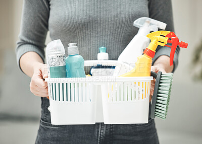 Buy stock photo Woman, cleaner or housewife holding cleaning supplies, detergents and hygiene tools or products in a basket. Hands of a housekeeper ready to do chores and housework for a clean and tidy home
