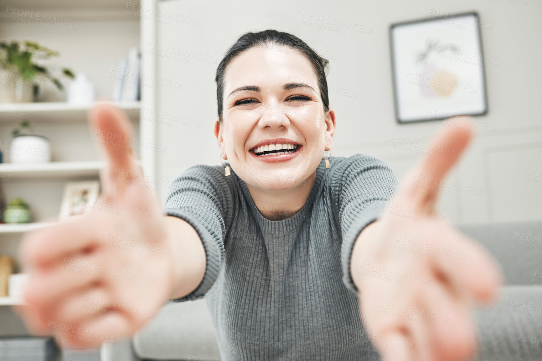 Buy stock photo Happy, smiling and laughing woman reaching out her arms for a hug, embrace or holding while relaxing alone at home. Portrait of a relaxed, content and cheerful female giving embrace and being playful