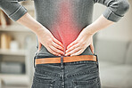 Back, pain and backache of a woman touching and holding a painful area on her body highlighted in red. Closeup of a female feeling strain, ache and discomfort from a glowing muscle injury problem