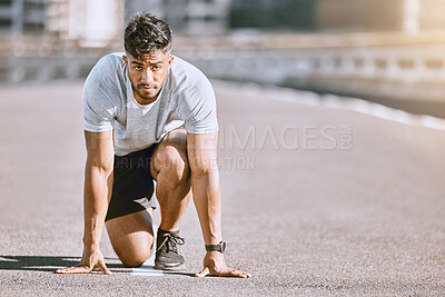 Buy stock photo Runner in starting position for race, run or cardio for healthy exercise, workout or fitness in urban city. Active, fit and serious male sports athlete ready for training, running fast and sprint