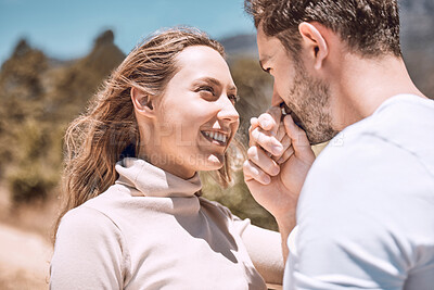 Buy stock photo In love, romance and smiling young couple bonding on sunny summer holiday or spring vacation. Hand kissing, cheerful and trendy romantic dating and relationship partners together on getaway trip.