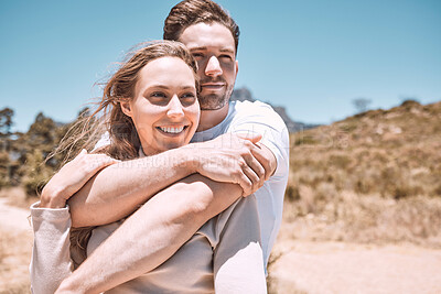 Buy stock photo Romantic, happy and in love young couple hugging together in outdoors nature walk, enjoying dating relationship and bonding time. Loving husband and wife holding each other in sweet caring embrace
