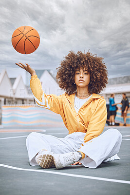 Buy stock photo Sitting, serious basketball player and fitness sports woman after a health, wellness and motivation workout portrait. Girl on a court, throwing a ball up and relax after game, training or exercise