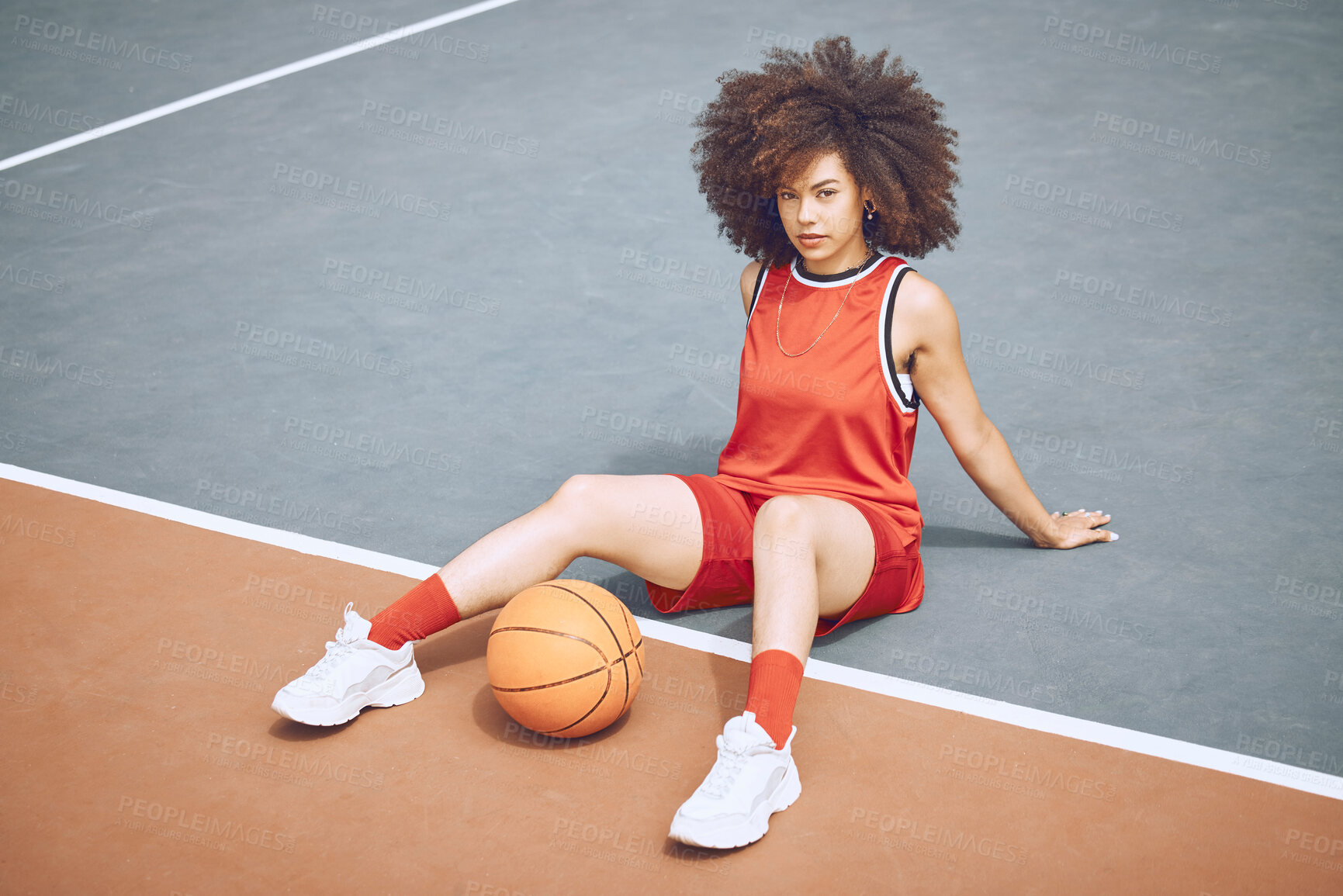 Buy stock photo Basketball player on court, getting ready for game and workout before fitness exercise outside. Portrait of a black woman sports person with afro playing, training and exercising in sport fashion