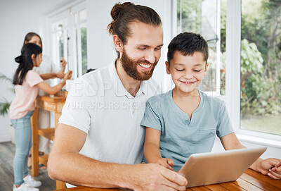 Buy stock photo Learning with tablet, watching educational videos and searching the internet with father and son relaxing together at home. Smiling, curious and happy boy browsing the web and having fun with parent