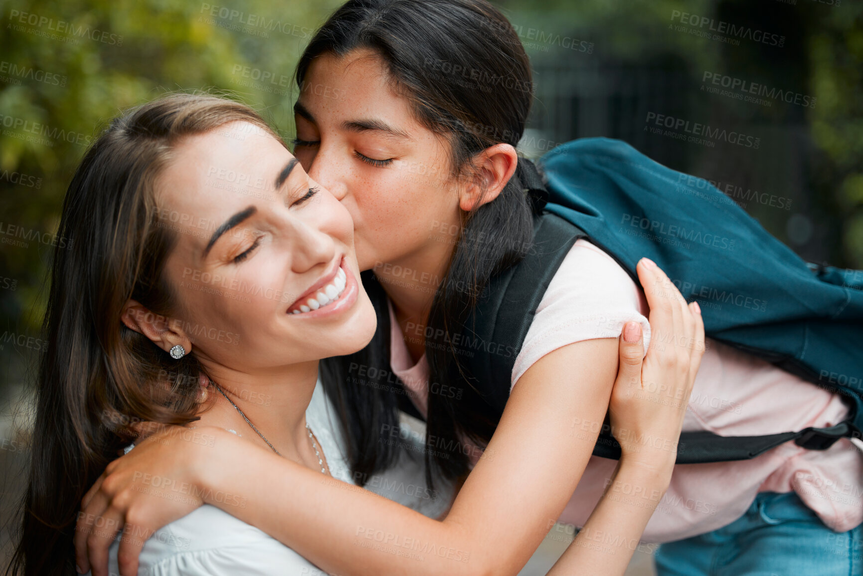 Buy stock photo Happy, smiling and young daughter kissing her mother, hugging and greeting before school in the morning. Loving, caring and cheerful parent embracing, holding and giving goodbye hug to little girl