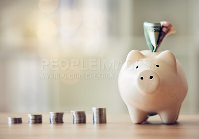 Buy stock photo Banking, accounting and financial management to plan for the future, collect a rainy day fund and profit. Piggybank, saving and finance with money, coins and cash in a coin bank on a table at home.