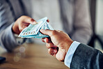 Hands of a businessman, exchanging money for a service, contract or purchase agreement. Closeup of depositing notes into a bank or investment. Cash, corruption and an African person bribing.