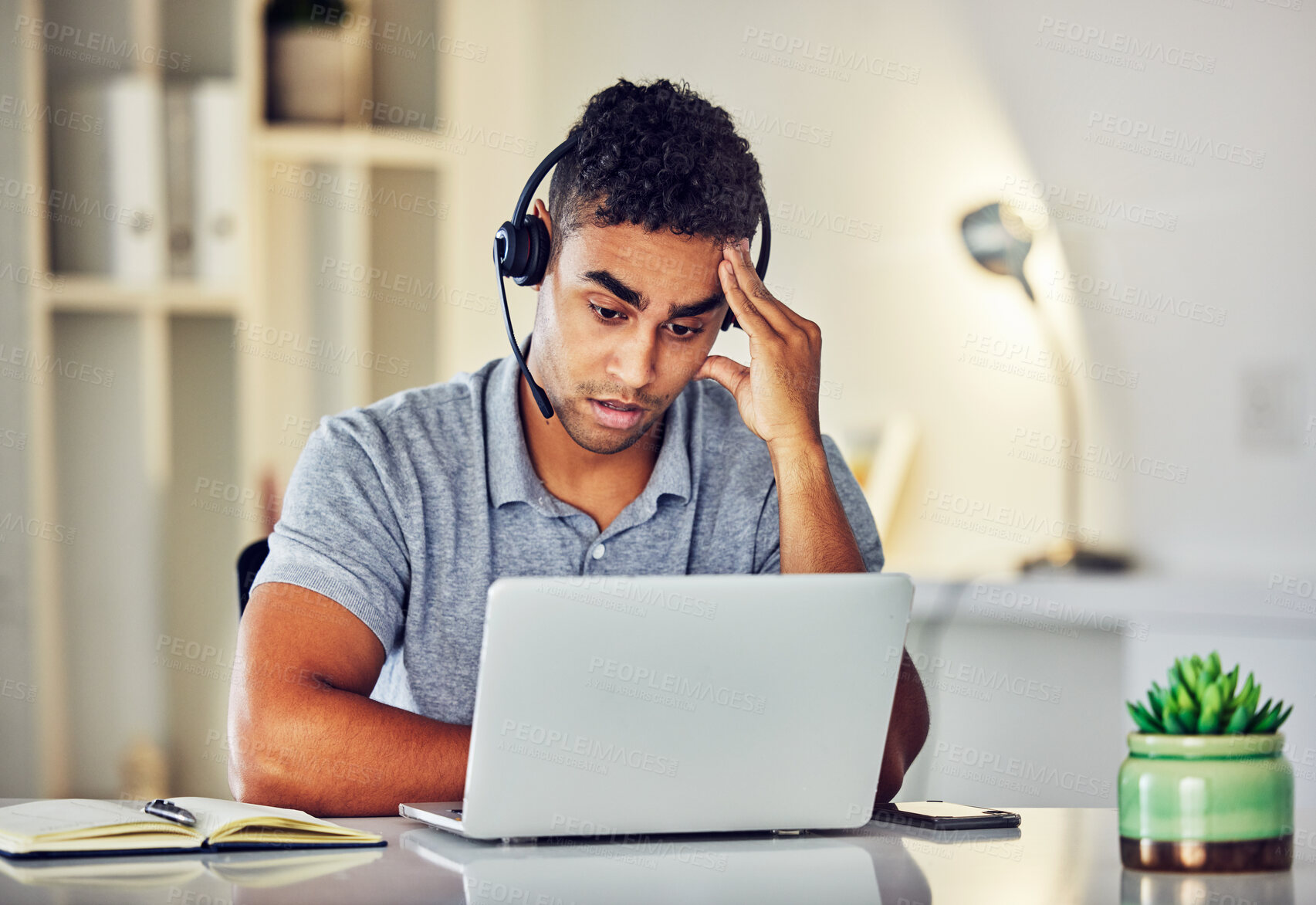 Buy stock photo Bored, tired and working customer service web support worker on an online computer call. Internet helpdesk male employee with a headset and headache feeling overworked from digital consulting job