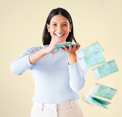 Buy stock photo Wealthy, rich and happy woman throwing money smiling about her financial success and freedom. Portrait of an excited young female having fun and enjoying her cash and ready to spend