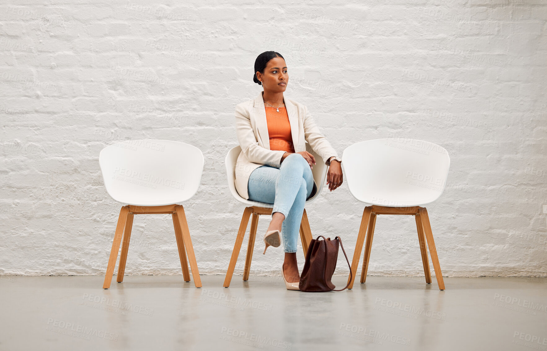 Buy stock photo Employment, hiring and recruitment with young woman sitting on a chair waiting for her interview with HR in a creative office. Female shortlist candidate ready for her meeting or appointment
