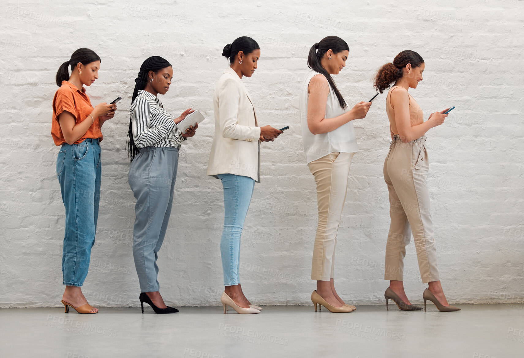 Buy stock photo Technology, phone and creative women standing while browsing the internet or social media. Group of students with diversity doing research on internet. Multiracial females waiting for an interview.