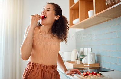 Buy stock photo Eating, chopping or making fruit salad with strawberries, bananas or healthy ingredients in home kitchen. Smiling or happy woman cooking, biting and tasting fresh snack food or preparing breakfast