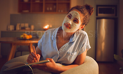 Buy stock photo Thinking woman writing ideas in book, doing beauty face mask for skincare and facial self care sitting in living room at home. Creative female looking thoughtful while planning routine in notebook