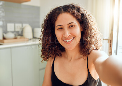 Buy stock photo Fun, happy and stylish woman taking a selfie for social media, dating app and online blog while relaxing at home. Portrait of relaxed lady on video chat, filming livestream or blogging from kitchen 