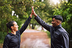 Fit, active and athletic couple stretching, getting ready and preparing for  workout, exercise and training. Portrait of smiling, sporty and healthy man  and woman in eco nature park, forest and garden