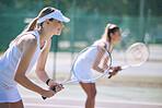 Fun women playing tennis match, practicing for competition and getting ready for sporty fitness game on a court outside, Female friends and teammates doing cardio training and sports workout together