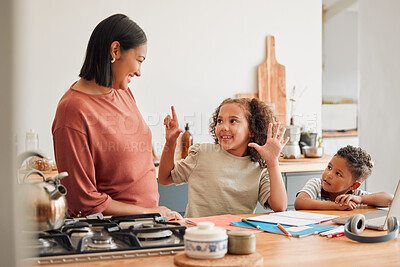 Buy stock photo A mother smiling, teaching and helping children with homework in the kitchen. Mom and kids using the internet to homeschool her young daughter and son, to help with math, for a happy family and kids.