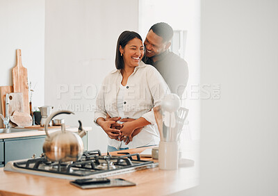 Buy stock photo Loving, happy and hugging couple relaxing in the kitchen at home smiling and laughing together. Carefree, excited and affectionate lovers having fun and enjoying quality time in the house