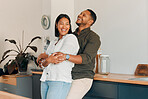 Hugging, embracing and in love couple in a home living room, kitchen or lounge and bonding, enjoying time together and relaxing. Smiling, happy and laughing man and affectionate woman standing close
