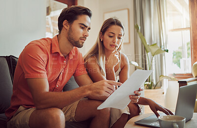 Buy stock photo Anxiety, debt and stress with a couple paying bills on a laptop, checking their budget and savings. Young husband and wife looking worried while reading a loan application or contract together