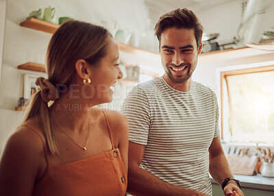 Buy stock photo Happy, laughing and loving couple bonding and having fun while spending time together at home. Joke, in love and carefree couple talking and sharing a romantic moment while enjoying the weekend
