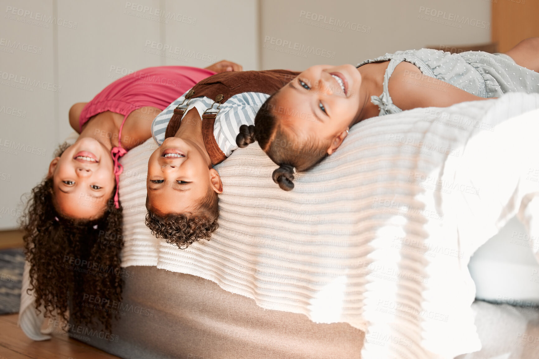 Buy stock photo Fun, playful and silly kids lying on a bed with cute hairstyle and smiling portrait. Little siblings relaxing, playing indoors showing growth, child development and childhood innocence