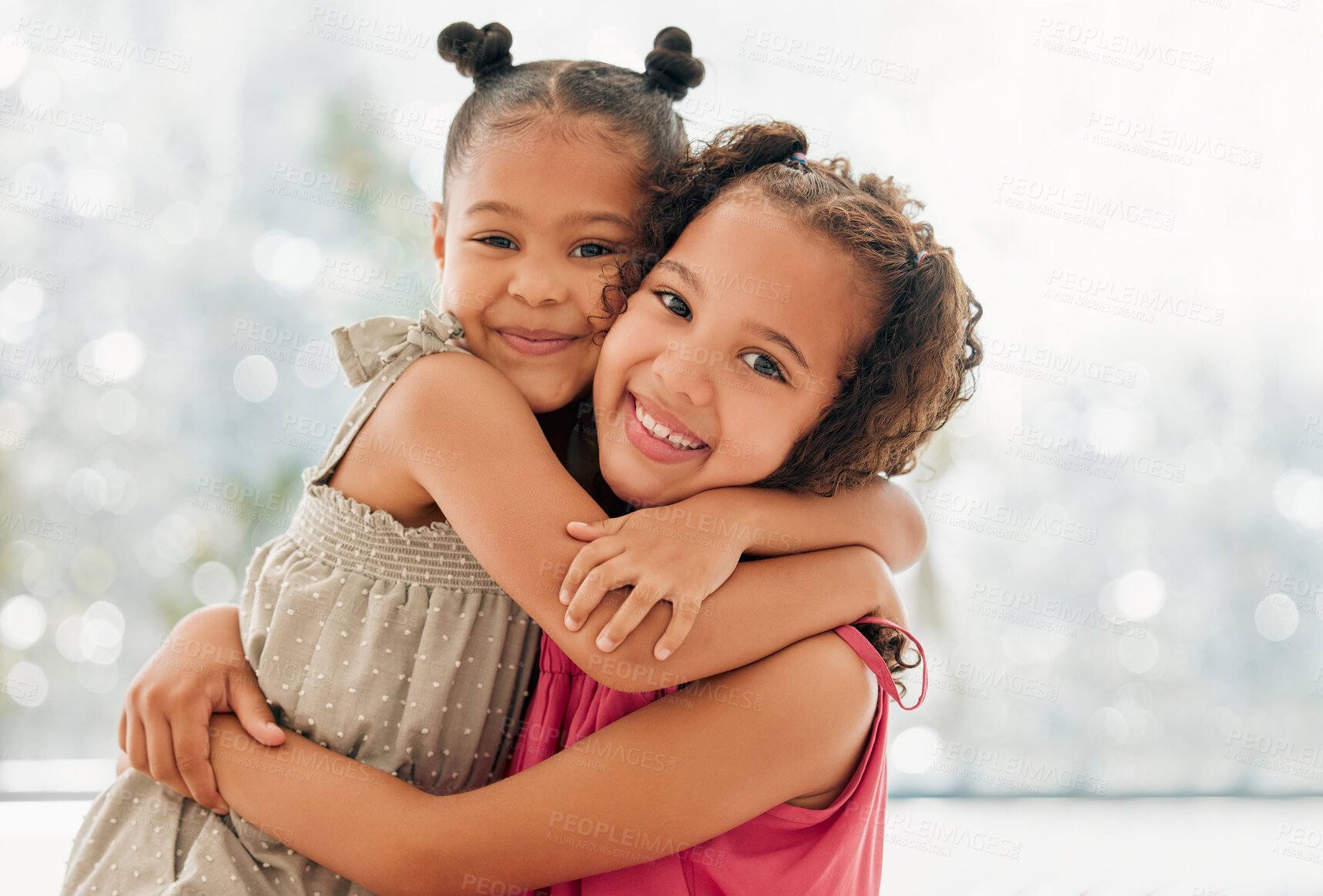 Buy stock photo Cute, adorable and sweet girls hugging and bond with a happy and healthy childhood growing at home. Portrait of innocent and loving sisters with a bright smile, affection and relaxing in the house