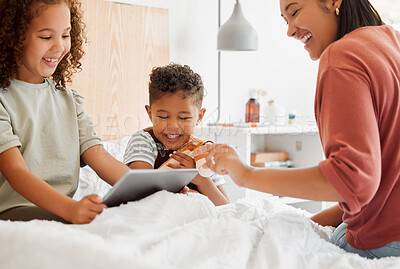 Buy stock photo Mother, daughter and son on a tablet relaxing in their home, watching fun cartoons and spending time together. Happy family, on a digital device learning and playing a game in the children's bedroom.