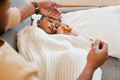Buy stock photo Sick, flu and cold child in bed, sad and ill with allergy and unwell at home with his worried mother. Parents hand on son's forehead for his temperature as she checks his fever with a thermometer
