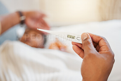 Covid, sick and hand holding thermometer closeup at home or hospital. Sick person with coronavirus or flu infection in their body. Ill health, headache and medical fever test with monitor in bed.