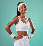 Happy, confident and smiling tennis player in sports uniform and hands on hips while ready to play with positive attitude. Fit and sporty female standing against a studio background with copy space
