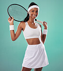 Female tennis player posing with racket, getting ready for competitive match and looking sporty while standing against blue studio background. Active, fit and happy professional sports person