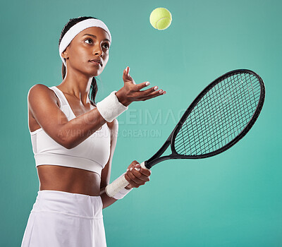 Buy stock photo Professional tennis player, sports woman isolated holding a racket ready for a game. Sporty, active and healthy athlete preparing for a serious sport competition or tournament on studio background.